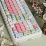 Side view of cheerful cute duck PBT Cherry profile keycaps set, revealing their smooth texture, crisp legends, and adorable whimsical design for mechanical keyboard.