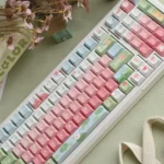Adorable Cute Duck PBT Keycaps Set for mechanical keyboards, showcasing whimsical cartoon ducks and soft pastel gradients for a cheerful, charming desk setup.