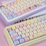 Whimsical Baby Zoraa Cute PBT keycaps set. Durable PBT keycaps with enchanting cartoon dolls, dreamy pastel aesthetic. Full compatibility.