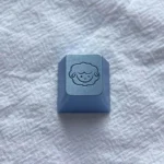 Whimsical blue sheep keycap, a handcrafted aluminum alloy artisan piece with vibrant metallic finish and intricate details for your ESC key.