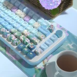 Charming PBT dye-sublimated keycaps set with fresh daisy floral design and vibrant backlighting, viewed from multiple artistic angles.