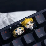 Detailed views of the Delta Force: Vlinder With Heart of Africa Keycap, highlighting intricate butterfly patterns, vibrant resin, and unique African style.