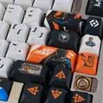 Multiple angles of the Delta Force Vyron Tactical PBT Keycap Set Elite Edition, showcasing its dark, military-inspired design and precise high-tech detail.