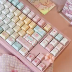 A close-up view of the Sweet Treats Dessert Keycap Set, featuring soft pastel PBT Cherry profile keys with charming dye-sub dessert motifs, perfect for fans.