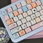 Close-up of vibrant Digimon MOA dye-sub keycaps set for mechanical keyboards, showcasing various cute nostalgic characters from multiple angles, enhancing design.