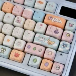 A vibrant collection of nostalgic Digimon keycaps set in cute MOA profile, displaying multiple characters with crisp dye-sub printing for mechanical keyboard.