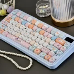 Playful Digimon keycaps set, vibrant and detailed dye-sub MOA profile. Nostalgic characters displayed from various angles for mechanical keyboards.