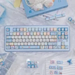 Vibrant blue and white Doraemon PBT dye-sub keycaps set showcasing beloved characters and iconic gadgets for a playful, nostalgic keyboard look.