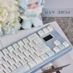Detailed views of Dream Butterfly PBT dye-sub keycaps set, revealing the exquisite serene blue and white ethereal butterfly motifs and durable construction.