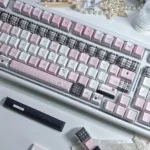 Dreamscape PBT Keycaps set, showcasing ethereal pastel gradients from multiple angles. Durable PBT and comfortable Cherry profile for a serene typing experience.