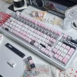 Ethereal Dreamscape PBT Keycaps set, showcasing soft pastel gradients. Durable PBT and comfortable Cherry profile create an artistic, serene keyboard.