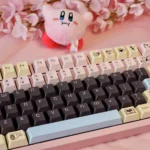 DuCato Cherry Keycap Set gallery. Vibrant five-sided dye-sub legends, playful character art, uniquely displayed from multiple angles.