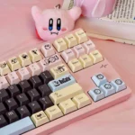 A vibrant collection of DuCato Cherry Keycap Set, showcasing detailed five-sided dye-sub legends and playful character art from multiple angle.