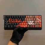 Vibrant EVA Asuka PBT keycaps, side-lit with translucent red and orange anime legends, showcased from an engaging angle for optimal backlighting.
