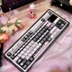 Elegant Lace Cat MAO Keycap Set, showcasing intricate feline silhouettes and sophisticated lace patterns from a distinct angle.