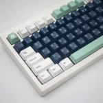 Premium Classic Emblem PBT Dye-Sub keycap set, displaying its durable construction and intricate heraldic symbols from various elegant angles.