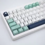 Close-up of the Classic Emblem PBT Dye-Sub Keycap Set, highlighting durable PBT material and intricate heraldic symbols from a distinct angle.