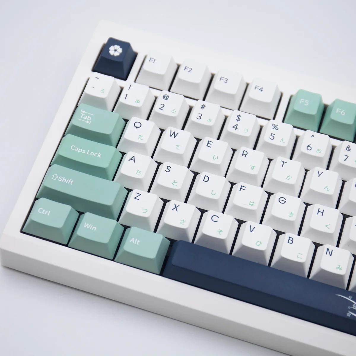 Close-up of the Classic Emblem PBT Dye-Sub Keycap Set for keyboards, highlighting durable, elegant heraldic designs. A premium emblem keycap set.