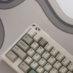 Precision CNC Moon ESC Keycap, viewed from a striking angle, highlighting its exquisite craftsmanship and reflective metallic surface, ideal for fans.