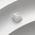 Close-up views of the precision CNC moon ESC keycap, showcasing its sleek celestial design and premium metallic finish from various angles.