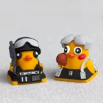Close-up side view of the whimsical handcrafted TEscape from Duckov: Duck Keycaps, highlighting the duck's detailed tactical gear.