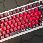 Iconic Evangelion Unit-02 Keycaps set. Fierce mecha aesthetics with bold red and black PBT keycaps. Detailed Unit-02 designs from various angles.