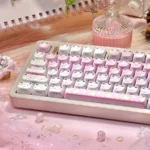 "Close-up of Fair Isle Cat Dye-Sub Keycaps showcasing intricate patterns and playful cat motifs from various angles, highlighting MAO side-engraved legend."