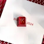 A festive fireworks keycap, precision CNC crafted, shown from various angles. Its intricate design captures brilliant festive moments.