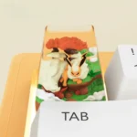 A close-up, angled view of the handcrafted Flareon Pokemon artisan ESC keycap, revealing its vibrant, fiery sculpture and meticulous, dynamic details.