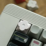 Close-up of a Floral Keycap set, showcasing delicate CNC aluminum etching from various angles, highlighting its captivating floral design.