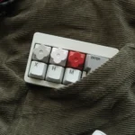 Main image of a Floral Keycap, featuring delicate floral motifs precision-etched into polished CNC aluminum, showcasing its artisan elegant.