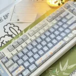 A collection of durable Midsummer Daisy Cherry Keycap Set featuring delicate daisy designs, showcasing various angles for a serene desktop aesthetic.