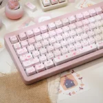 Close-up of the adorable pink fox dessert PBT dye-sub keycap set, showcasing its whimsical design and sweet details from a unique angle.