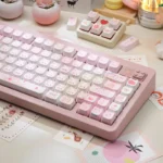 Close-up of the adorable pink Fox Dessert PBT keycap set, showcasing its whimsical sweet design and intricate dye-sub details from a side angle.