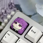 Close-up of a handcrafted Fern resin ESC keycap, showcasing intricate anime character details and vibrant artistry from multiple angles.