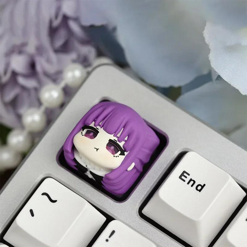 Close-up of a handcrafted Fern resin ESC keycap, showcasing intricate anime character details and vibrant artistry from multiple angles.