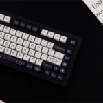 A premium PBT MOA galaxy keycap set. This image highlights the striking black and white celestial patterns and ergonomic MOA profile.