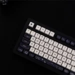 Detailed view of Cosmic Elegance Galaxy PBT MOA keycaps set, showcasing premium PBT, striking black and white cosmic patterns, and unique MOA profile.