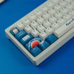Exclusive Gawr Gura PBT Dye-Sub Keycaps set. Vibrant blue, white, and red keycaps display the iconic shark-girl aesthetic from all angles.
