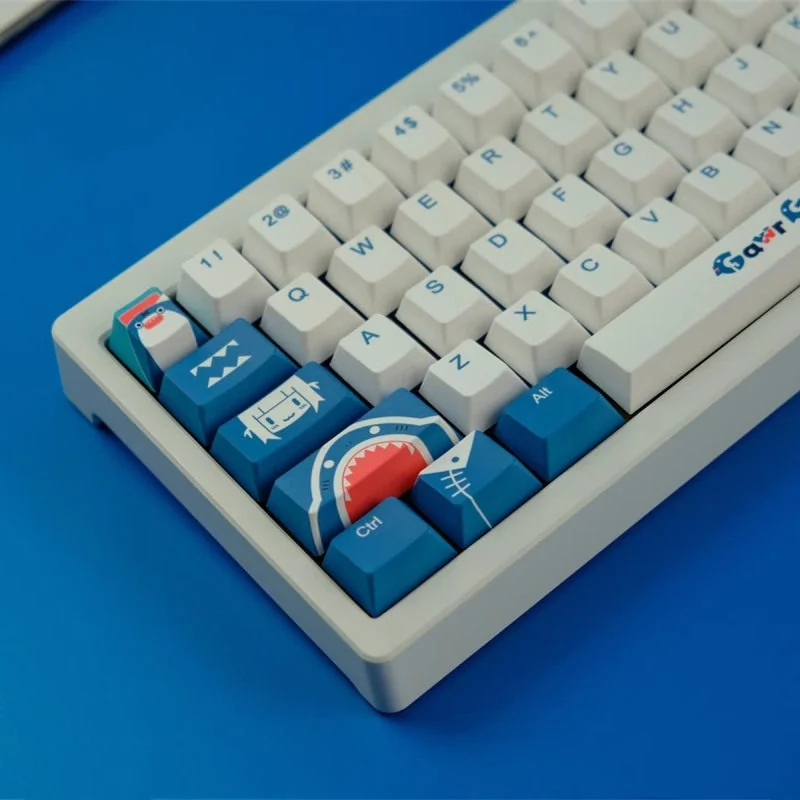 Exclusive Gawr Gura PBT Dye-Sub Keycaps set. Vibrant blue, white, and red keycaps display the iconic shark-girl aesthetic from all angles.