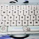 Unique Glacier Bear PBT Dye-sub MOA keycaps set, beautifully showcasing its adorable bear motif and serene icy blue and white color palette.