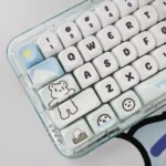 Glacier Bear PBT Dye-sub MOA Keycaps Set. Unique icy blue and white design, adorable bear motifs, winter landscape. Displayed from a new angle.