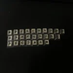 Handcrafted Gothic Alphabet Keycaps Set, showcasing intricate medieval-inspired craftsmanship from various angles. Dark, antique artistry for unique design.