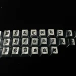 A collection of handcrafted Gothic alphabet keycaps set, showcasing intricate medieval designs from various angles. These timeless artistry keycaps.