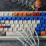 Iconic RX-78-2 Battle-Damaged Gundam keycaps set, shown from multiple angles, highlighting its intricate weathered mecha aesthetic.