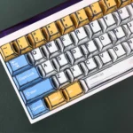 Close-up of vibrant Gundam manga art PBT keycaps set, showcasing iconic Mobile Suit characters in a dynamic, artistic style.