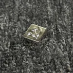 Premium gold-plated copper Hammer Sickle keycap, showcasing its iconic design and lustrous brass and white copper craftsmanship from multiple angles.