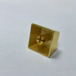 Premium Hammer Sickle keycap, plated in lustrous brass and white copper, showcasing its iconic design and pure craftsmanship from various angle.