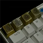 Hamsa Artisan Keycap featuring intricate metalwork, polished brass, and copper finishes. This elegant keycap offers mystical, symbolic protection.