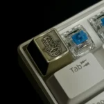 Detailed views of the Hamsa artisan keycap, showcasing intricate brass and copper designs, embodying mystical protection and artistic elegance.